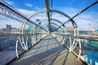 Steel and glass bridge for pedestrians crossing over the railway
