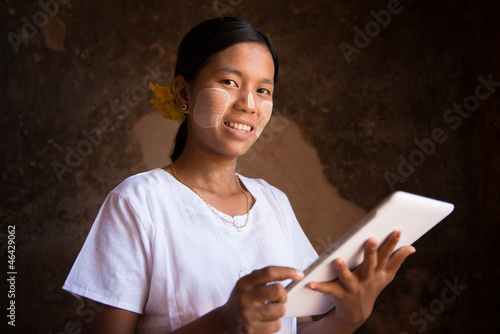 Photo: Myanmar girl using tablet computer Myanmar girl using tablet computer