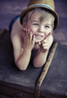 Little boy playing toy windmill