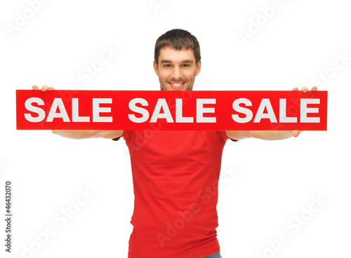 Photo: handsome man with sale sign handsome man with sale sign
