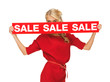 lovely woman in red dress with sale sign