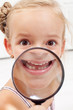 Little girl showing missing teeth