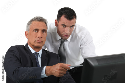 Photo: Businessmen at a computer Businessmen at a computer