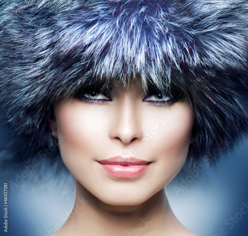 Photo: Fashion. Beautiful Girl in Fur Hat. Winter Woman Fashion. Beautiful Girl in Fur Hat. Winter Woman