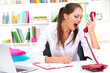 Photo: angry businesswoman with phone at office angry businesswoman with phone at office
