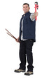 Plumber with wrench and pipe