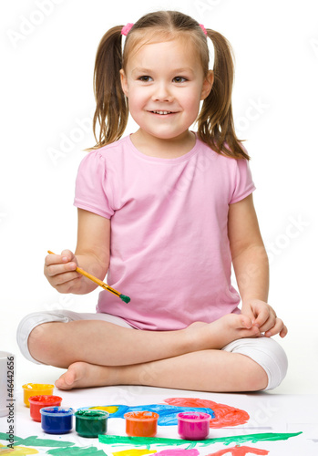 Photo: Cute cheerful child play with paints Cute cheerful child play with paints