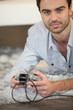 Man playing game on console