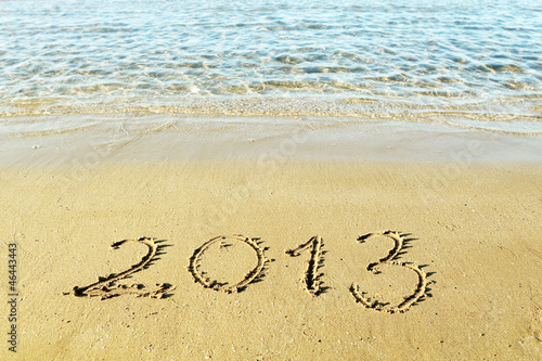 Photo: The inscription "2013" on a beach sand The inscription "2013" on a beach sand