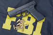 9mm handgun with ammo on fbi uniform