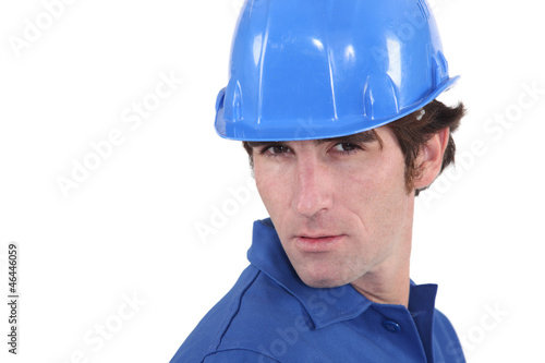Photo: Closeup of a man in a hardhat Closeup of a man in a hardhat