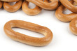 One oval donut next to a group of bagels