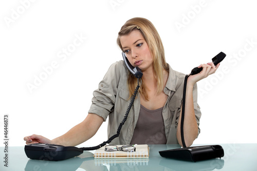 Photo: Overworked receptionist Overworked receptionist