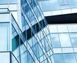 View to steel blue background of glass high rise buildings