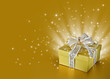 Photo: Golden surprise gift box or present with ribbon, bow, stars Golden surprise gift box or present with ribbon, bow, stars