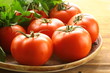 ripe organic tomatoes on a wooden table