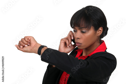 Photo: Woman checking watch Woman checking watch