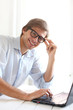 Handsome young man working in his office