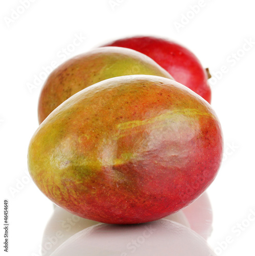 Photo: Ripe appetizing mango isolated on white Ripe appetizing mango isolated on white