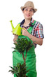 Girl watering plants on white