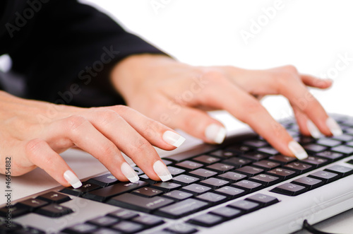 Photo: Hands working on the keyboard Hands working on the keyboard
