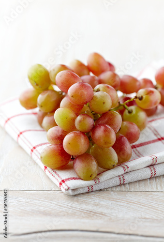Photo: Bunch of grapes on kitchen towel Bunch of grapes on kitchen towel