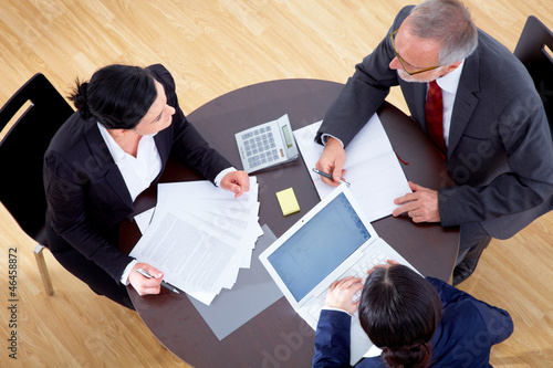 Photo: Meeting with three business people Meeting with three business people