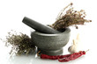 dried herbs in mortar and vegetables, isolatrd on white