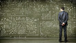 Business person against the blackboard