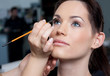 Make up artist applying make up to a fashion model/bride.