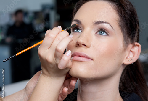Photo: Make up artist applying make up to a fashion model/bride. Make up artist applying make up to a fashion model/bride.