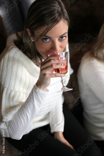Photo: Woman drinking wine with friends Woman drinking wine with friends
