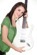 Pretty girl holding guitar