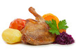 Roast duck with red cabbage and apples.