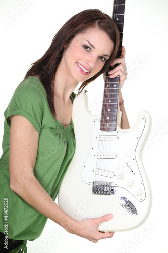 Photo: Pretty girl holding guitar Pretty girl holding guitar