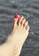 Female foot with pink nail polish