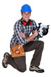 Carpenter holding circular saw