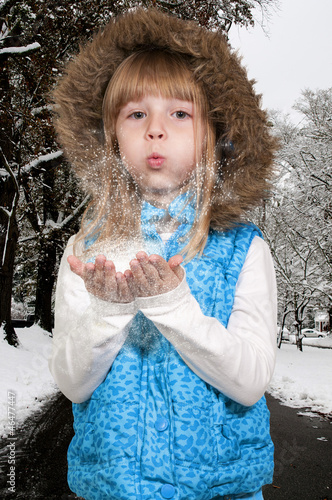 Photo: Girl Blowing Snow Girl Blowing Snow