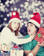 Girl strangling her boyfriend for a christmas gift.