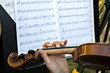 Wooden Violin and Sheet Music