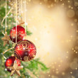 Christmas theme with red glass balls and free space for text