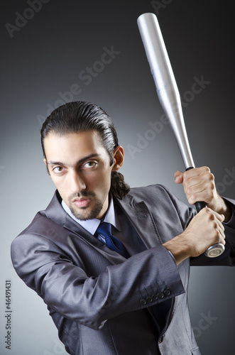 Photo: Angry businessman with bat on white Angry businessman with bat on white