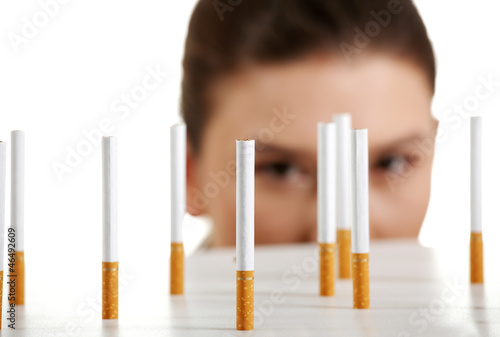 Photo: Young woman looking on cigarettes Young woman looking on cigarettes