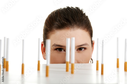 Photo: Young woman looking on cigarettes Young woman looking on cigarettes
