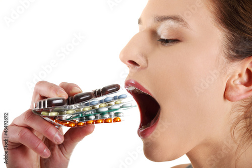 Photo: Young beautiful ill woman with pills. Young beautiful ill woman with pills.