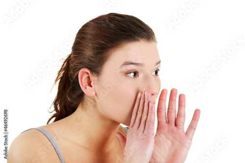 Photo: Youngwoman talking gossip Youngwoman talking gossip