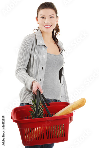 Photo: Happy woman with shopping basket Happy woman with shopping basket