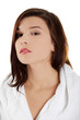 Young beautiful woman in bathrobe