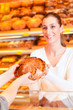 Salesperson with female customer in bakery