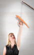 Woman Reaching for Carrot Stick